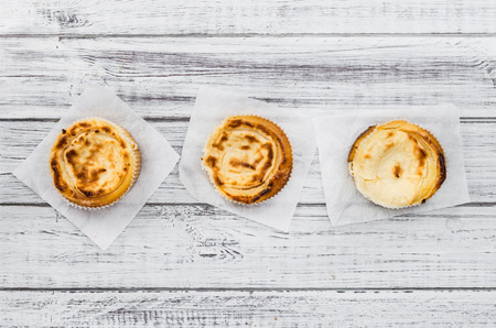 Homemade Cheesecake on an wooden table (selective focus) as detailed close-up shotの写真素材
