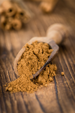 Fresh made Cinnamon Powder on a vintage background (close-up shot)の写真素材