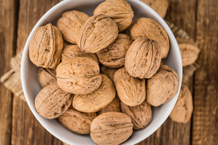 Portion of fresh Walnuts (close-up shot; selective focus)の写真素材