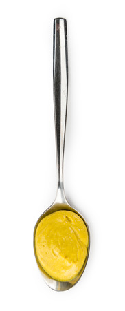 Portion of Mustard (as close-up shot) isolated on white backgroundの写真素材