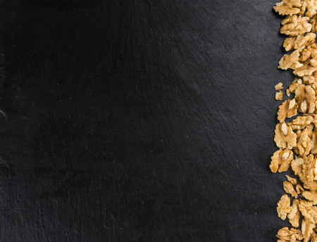 Portion of fresh Walnut kernels (close-up shot; selective focus)	
