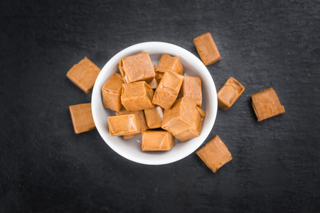 Caramel on a vintage background as detailed close-up shot (selective focus)の写真素材