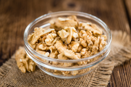 Portion of fresh Walnut kernels (close-up shot; selective focus)