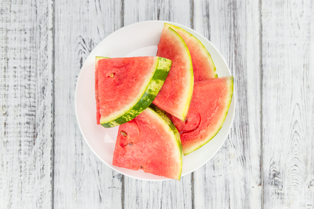 Watermelon on a vintage background as detailed close-up shot (selective focus)の写真素材