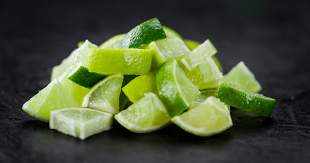 Portion of fresh Lime Slices (close-up shot; selective focus)の写真素材