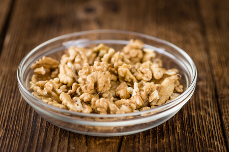 Walnut kernels on a vintage background as detailed close-up shot (selective focus)の写真素材