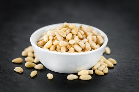 Pine Nuts on a vintage background as detailed close-up shot (selective focus)の写真素材