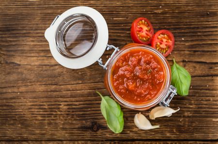 Tomato Sauce on a vintage background as detailed close-up shot (selective focus)の写真素材