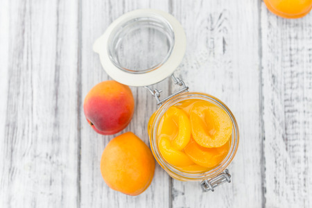 Pickled Apricots on a vintage background as detailed close-up shot (selective focus)の写真素材