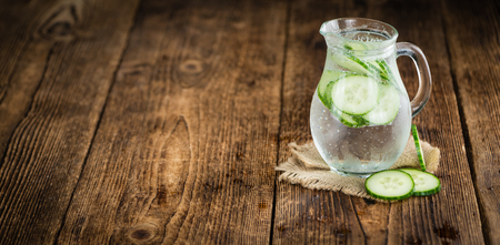 Cucumber Water on a vintage background as detailed close-up shot, selective focusの写真素材