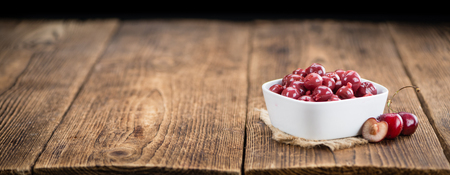 Fresh made Canned Cherries on a vintage background as detailed close-up shotの写真素材