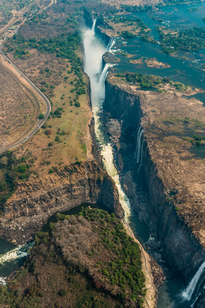 Victoria Falls in Zimbabwe at drought, aerial shot made from a helicopterの写真素材