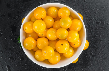 Portion of fresh Yellow Tomatoes  close-up shot; selective focus