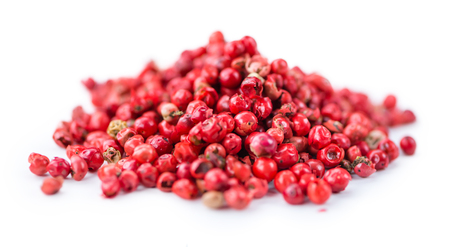 Portion of Pink Peppercorns as detailed close-up shot isolated on white backgroundの写真素材
