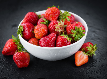 Strawberries on a vintage background as detailed close-up shot, selective focusの写真素材