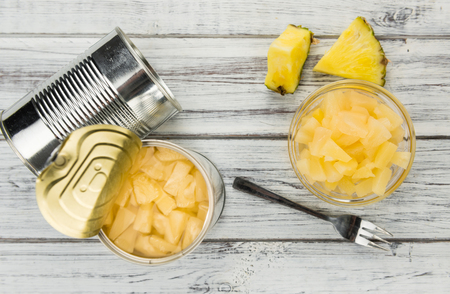 Preserved Pineapple pieces on a vintage background as detailed close-up shot, selective focusの写真素材