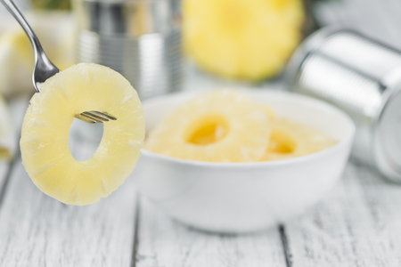 Preserved Pineapple Rings on a vintage background as detailed close-up shot, selective focusの写真素材