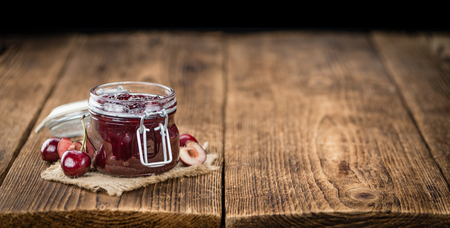 Fresh made Cherry Jam on a vintage background as detailed close-up shotの写真素材