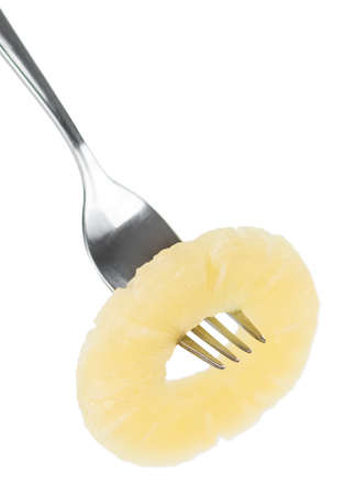 Fresh made Preserved Pineapple Rings isolated on white background; close-up shotの写真素材