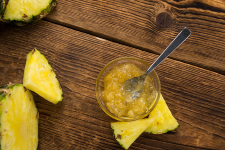 Fresh made Pineapple Jam on a vintage background as detailed close-up shotの写真素材