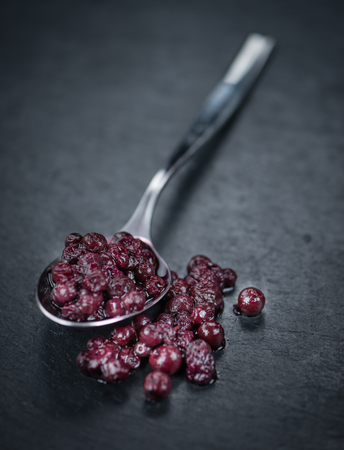Preserved Blueberries on a vintage background as detailed close-up shot, selective focusの写真素材