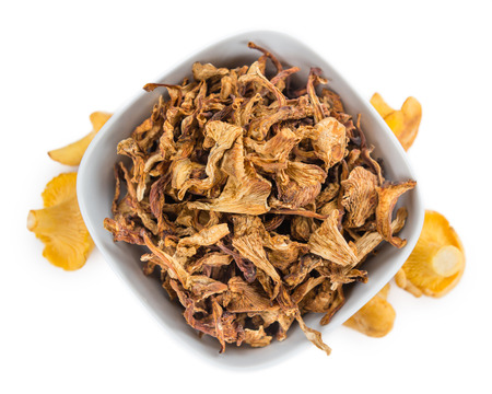 Portion of Dried Chanterelles as detailed close-up shot isolated on white backgroundの写真素材