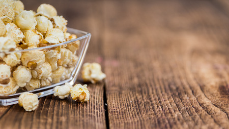 Fresh made Popcorn on a vintage background as detailed close-up shotの写真素材