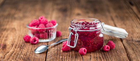 Fresh made Raspberry Jam on a vintage background as detailed close-up shot