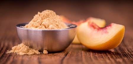 Ground Peaches on a vintage background as detailed close-up shot, selective focusの写真素材