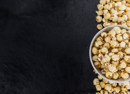 Some Popcorn on a vintage slate slab, selective focusの写真素材