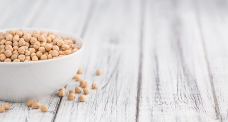Chickpeas on a vintage background as detailed close-up shot, selective focusの写真素材