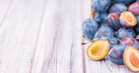 Portion of fresh Plums  close-up shot; selective focusの写真素材