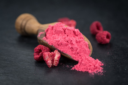Fresh made Raspberry powder on a vintage background as detailed close-up shotの写真素材