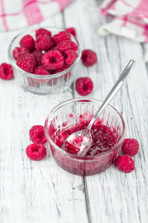 Fresh made Raspberry Jam on a vintage background as detailed close-up shotの写真素材
