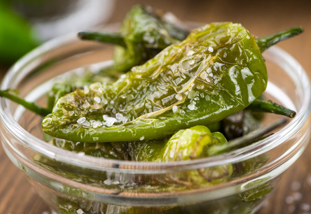 Pimientos de Padron on a vintage background as detailed close-up shot, selective focusの写真素材