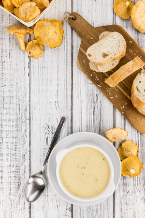 Portion of fresh Chanterelle Soup  close-up shot; selective focusの写真素材