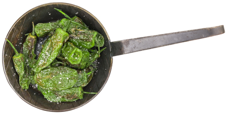 Portion of Pimientos de Padron as detailed close-up shot isolated on white backgroundの写真素材