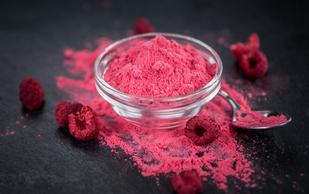 Fresh made Raspberry powder on a vintage background as detailed close-up shotの写真素材