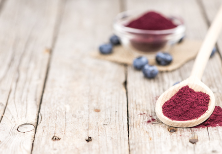 Fresh made Blueberry Powder on a vintage background as detailed close-up shotの写真素材