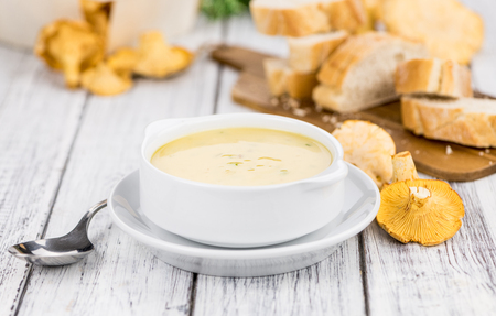 Portion of fresh Chanterelle Soup  close-up shot; selective focusの写真素材