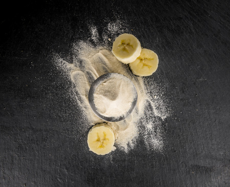 Portion of Banana Powder as detailed close up shot on a slate slab; selective focusの写真素材