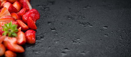Strawberries (Chopped) on a vintage background as detailed close-up shot, selective focusの写真素材