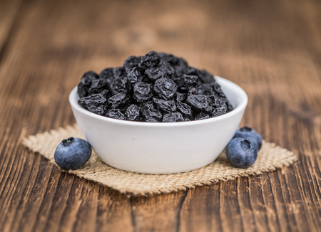 Dried Blueberries on a vintage background as detailed close-up shot, selective focusの写真素材
