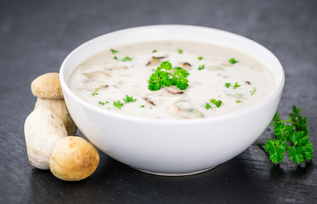 Porcini Soup on a vintage slate slab as detailed close-up shot; selective focusの写真素材