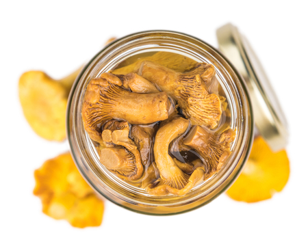 Portion of Canned chanterelles as detailed close-up shot isolated on white backgroundの写真素材