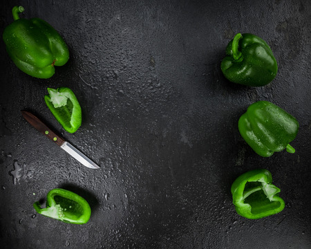 Slate slab with Green paprika (selective focus; close-up shot)