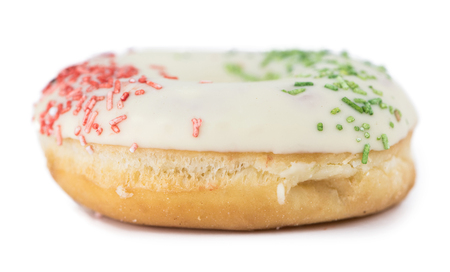 Some fresh made Donuts isolated on white background (close-up shot)の写真素材