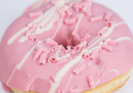 Portion of pink glazed Donuts (detailed close-up shot)の写真素材