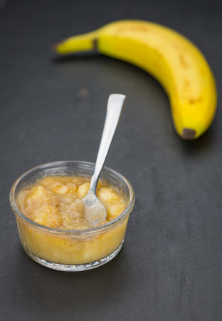 Banana Puree on a slate slab (close-up shot; selective focus)の写真素材
