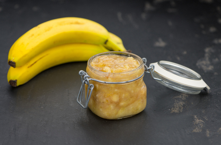 Mashed Bananas (on a vintage slate slab) as detailed close-up shotの写真素材